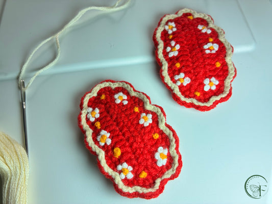 Red Rosettes crochet hair clips featuring hand-stitched white flowers with yellow centers – artisan baby girl barrettes
