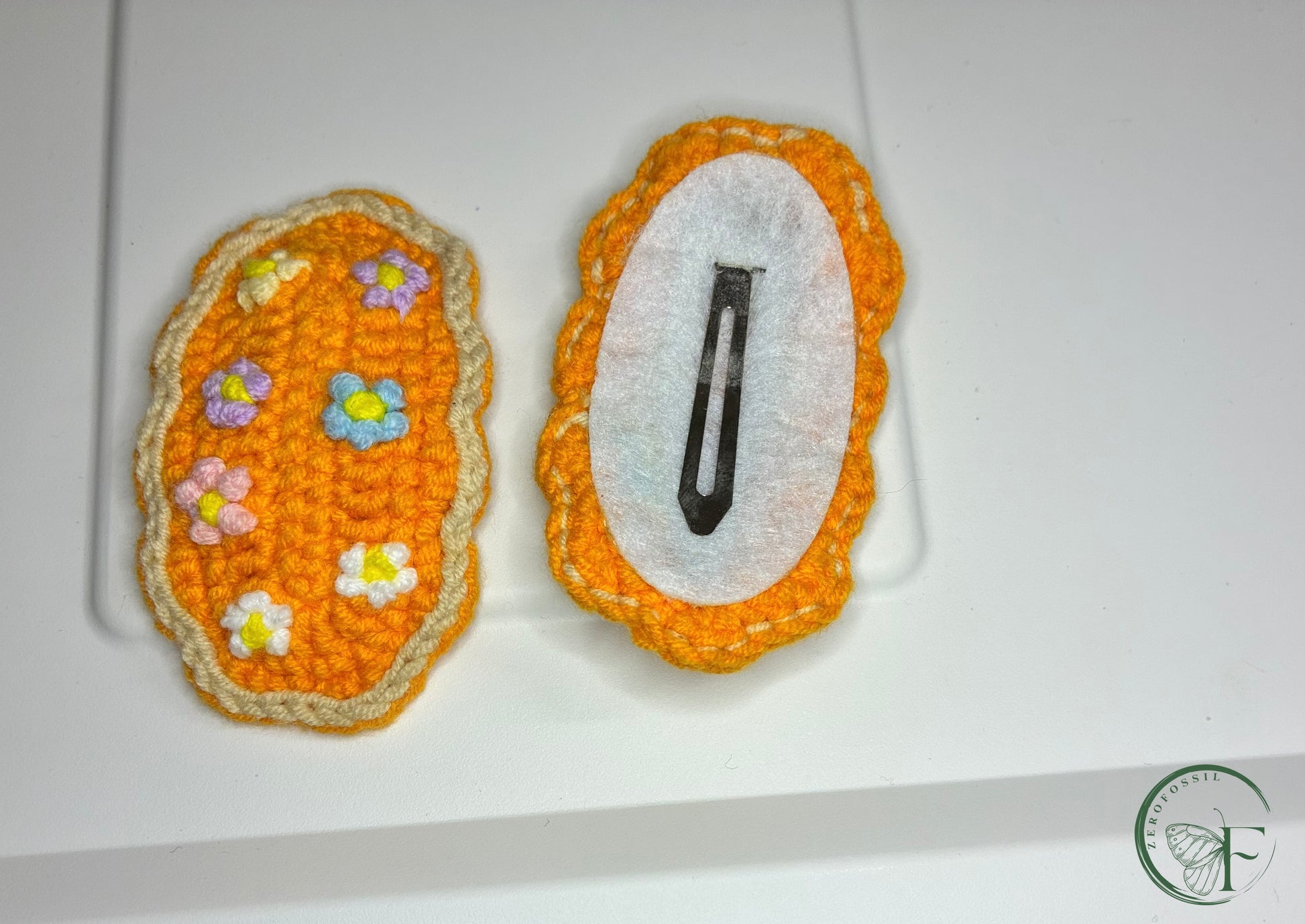 orange premium crotchet hair clip for baby handcrafted in India