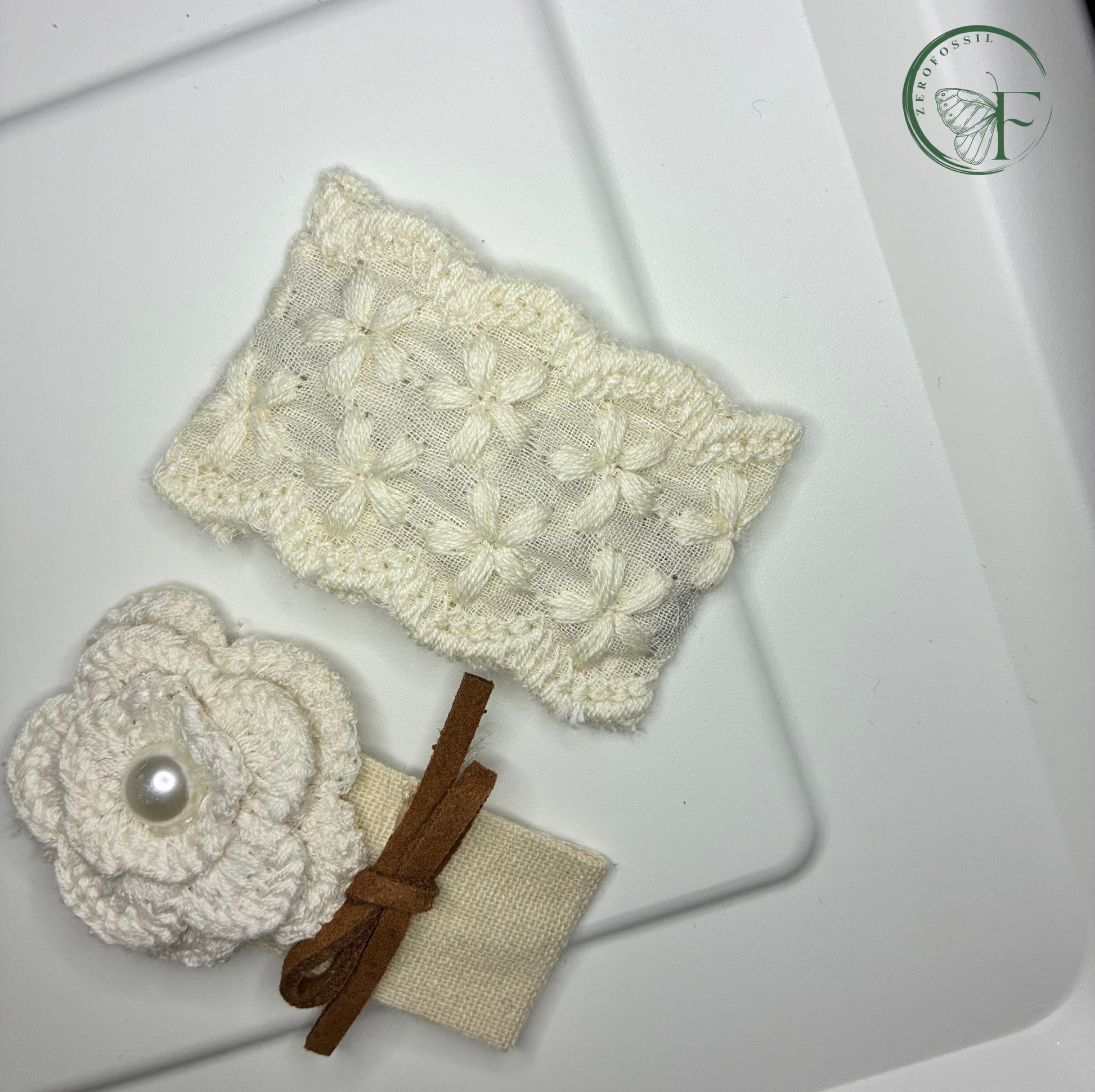 White lace headband with a flower accessory