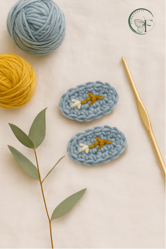 Minimalist botanical-themed crochet hair clip for girls with stitched flower and leaf detailing on a blue base