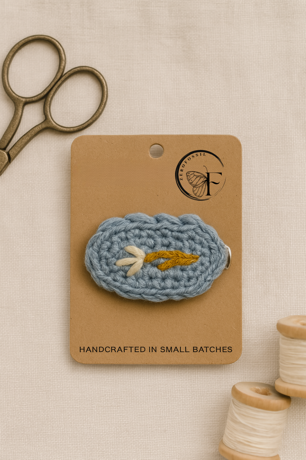 Artisan crochet barrette with soft yarn base and golden twig design – eco-friendly hair accessory for toddlers