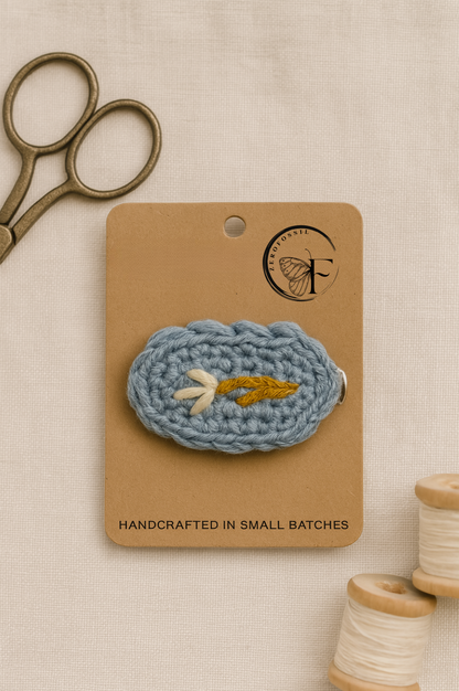 Artisan crochet barrette with soft yarn base and golden twig design – eco-friendly hair accessory for toddlers