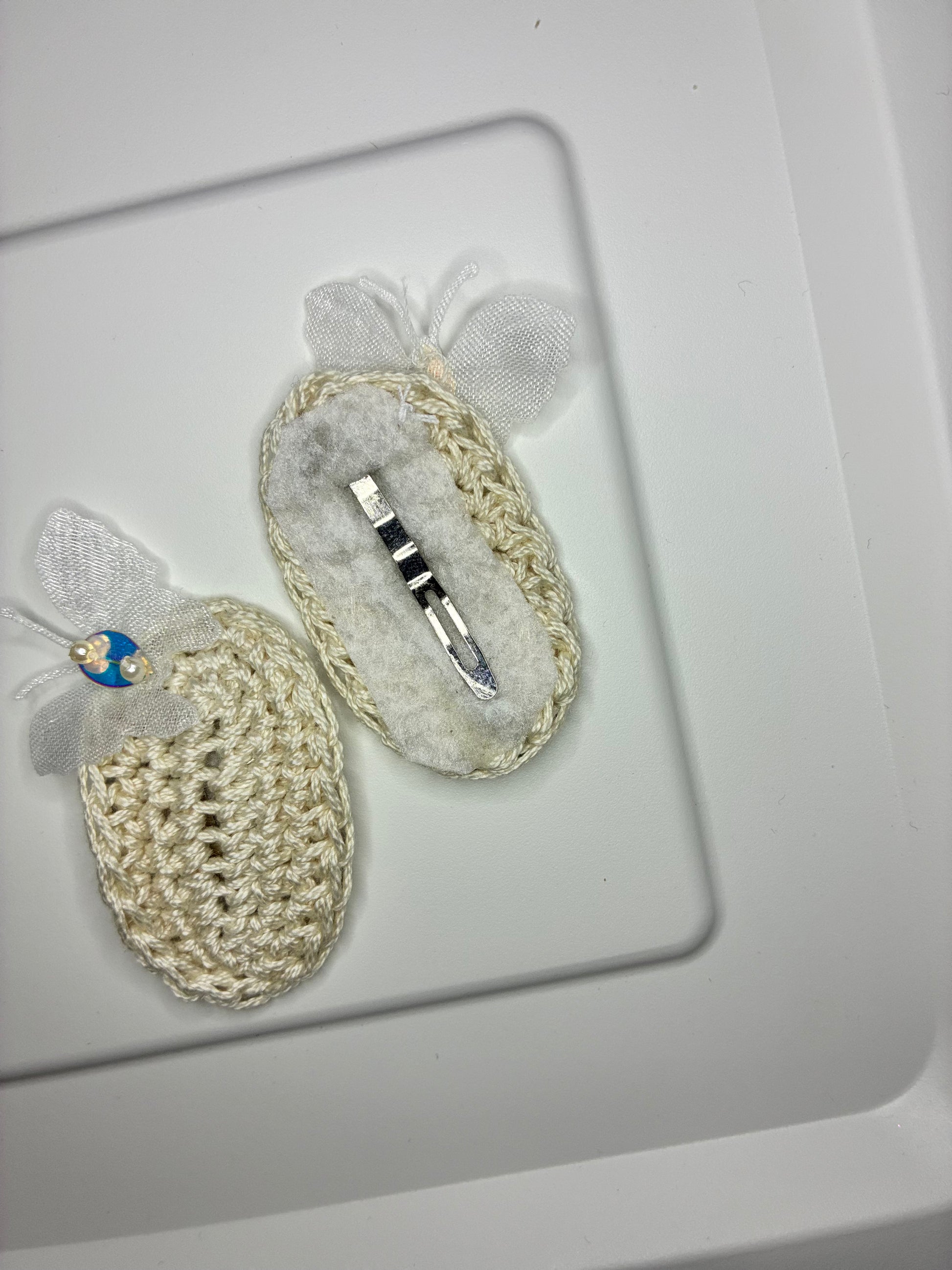 Crocheted hair clips with a barrette on a white background