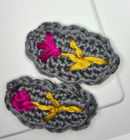 Storm Petal embroidered crochet hair barrettes featuring vivid floral stitching on a dark base – artisan clip for baby girls